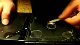 How to clean my Playstation 2 slim laser. Fix the PS2 slim disc read error!