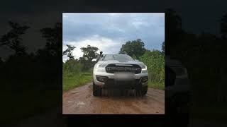 Ford Endeavour splashing water while crossing the stream off-road