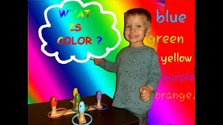 CHILD PLAYS AND LEARNS COLORS