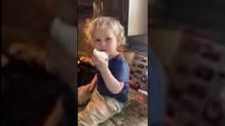 2 year old eating a raw onion