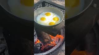 How do you like your eggs cooked over the campfire? #asmr #asmrsounds #food #shorts