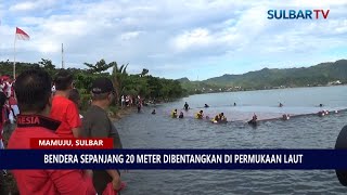 BENDERA SEPANJANG 20 METER DIBENTANGKAN DI PERMUKAAN LAUT