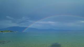 Wonderful rainbow on lake Garda - Italy landscape