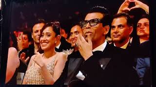 SRK & Vicky giving KJO an award for completing 25 years in the industry, his reaction seemed genuine