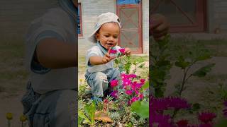 Cute baby playing🪴#baby #cute  #flowers #garden #trending #goviral #dosubscribe @asthathapavlog