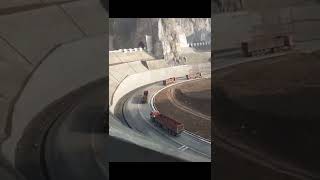 Semi-trailer driving on winding road