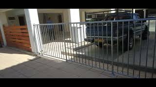 Galvanized metal fence around the pool to protect children from approaching the pool