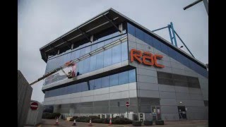 Applying the Bloodhound vinyl onto our operations centre next to the M6