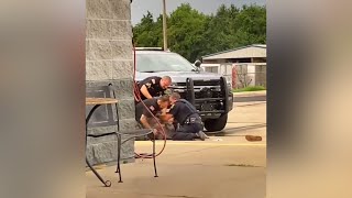 Arkansas officers suspended with pay after video shows them beating man: What we know