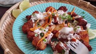 Crispy flavorful fried potato loaded with sweet&tangy yogurt sauce with some fresh onion and herbs!