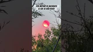 El humo provocado por incendios en el cerro hizo que el sol se viera rojo.