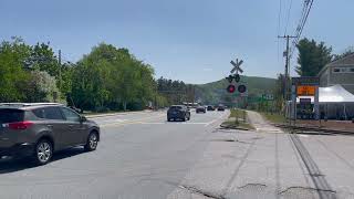 Granite State Scenic Railroad train crossing through town