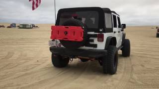 Ladies riding into the dunes.