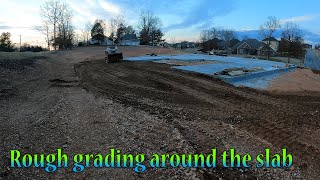 Digging A Water Line And Rough Grading Around This New Slab House