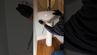 Replacing a faucet and drain on a pedestal sink🚰💦 #plumbing #plumber #asmr #diy #shortsvideo