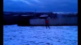 Lewis fox 'Sledging' on a Bodyboard across Snow in Londonderry Farm Bideford