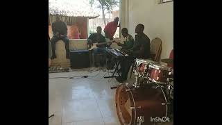 John Chiti with band rehearsing