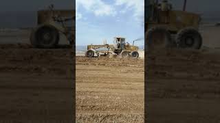 Grader on the mountain at work