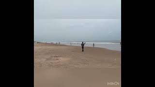 Playing cricket in Bapatla Suryalanka Beach