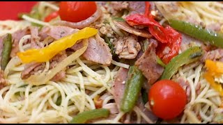 Il nous cuisine des Capellini Sautés au Jambon