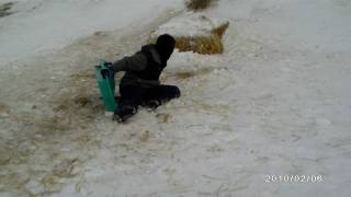 Kyle sledding off the ramp.MOV