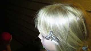 A sphinx moth lands on little girl's head!