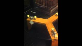 Rotating Skateboard Glass table @ Future Perfect