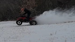 banshee race quad with tracks wrapped on the tires