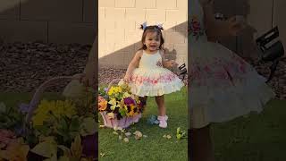 Baby and a basket of flowers