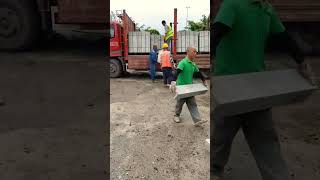 Workers transport cement columns