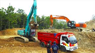 Earthmoving Excavators Digging loading Dirt into Dump Trucks