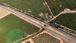 Following a long train into Lincoln