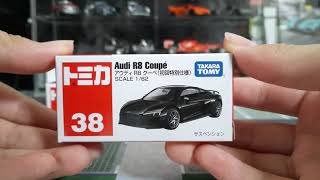 Tomica Toyota RAV4 And Audi R8 Coupé diecast cars.