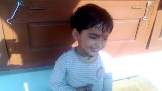 Baby playing with stones