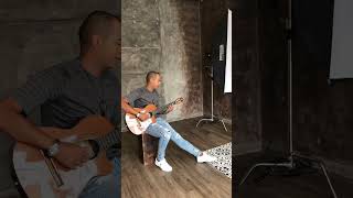 Nilton G - seating playing guitar (photoshoot)