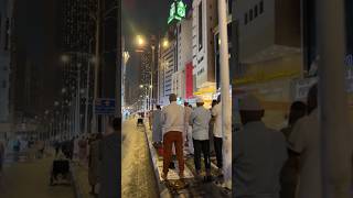 Performing the Isha prayer in the streets of Makkah