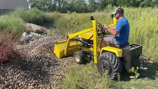 landscape,adding river rock with Cub Cadet 129, front end loader