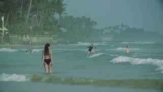 Surfer girl in the ocean - surfing in Sri Lanka - Episode 1