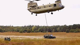 Dutch and US soldiers practice an air raid demonstration to commemorate Market Garden