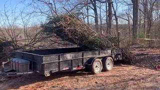 Unloading brush from a utility trailer quickly