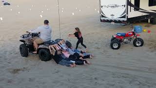 Using kids to groom your sand camp site for UTV Takeover 2022!