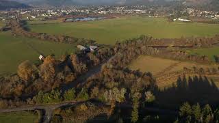 Colorful autumn scene of river and fields in myrtle point, coos county, oregon at daytime