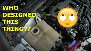 Removing a broken coolant reservoir cap from a Ford Focus and Mustang