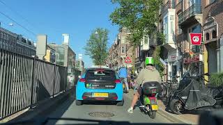 A sunny summer morning commute with the cyclists in Amsterdam. I am turning onto the Overtoom.