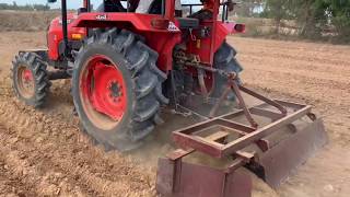 Kubota mu4501 4wd tractor working on field