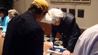 Country Singer Marty Stuart signing several autographs - TopSignatures.com