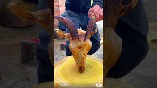 Chef cuts buffalo head for cooking