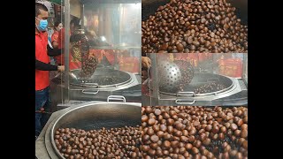 Roasting chestnut with hot stones in the big pan Chinatown Bangkok - Bangkok Street Food