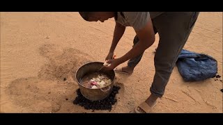 The chefs cook while we are visiting a miner's camp in the Sahara Desert of Mauritania.