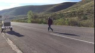 Man running, trying to register on auto speed sign